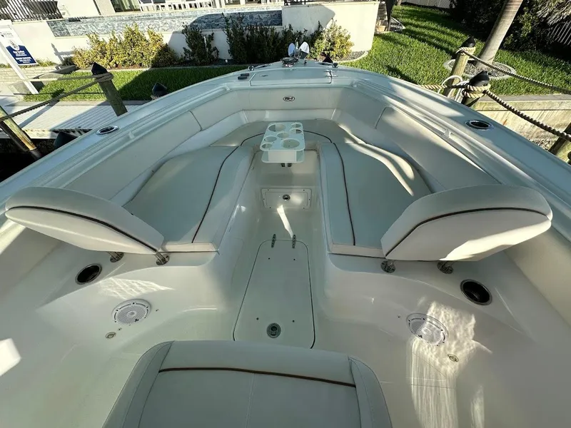 Slide: The Image of 2022 Sea Hunt Ultra 255 SE boat interior with spacious seating and cup holders. - 9