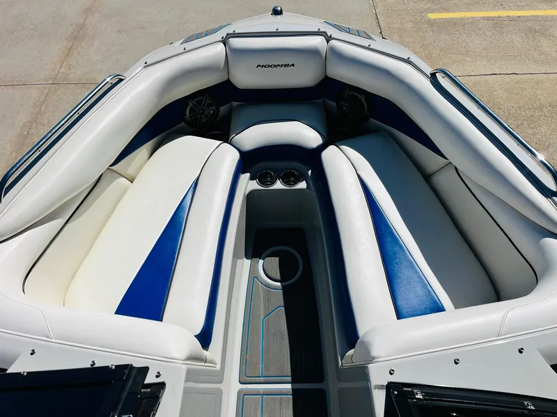 Slide: The Image of 2012 Moomba Mojo 2.5 boat interior with white and blue seating. - 10