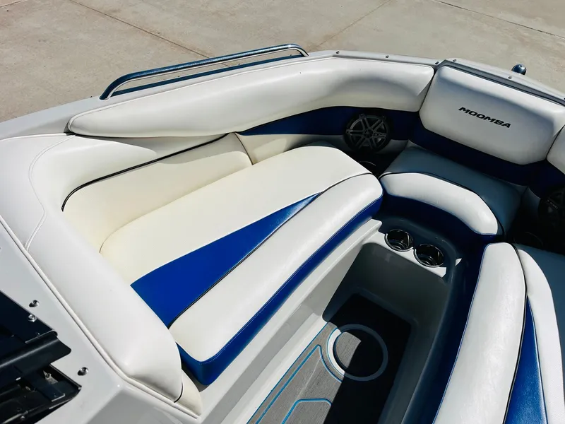 Slide: The Image of 2012 Moomba Mojo 2.5 boat interior with white and blue seating. - 11