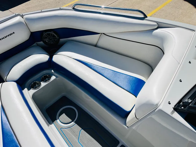 Slide: The Image of 2012 Moomba Mojo 2.5 boat interior with blue and white seating. - 12
