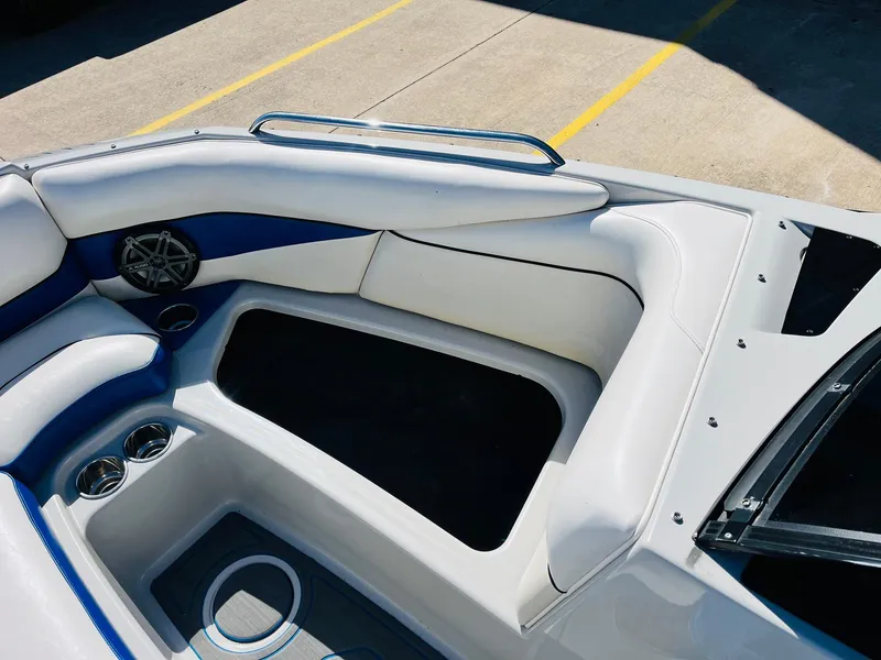 Slide: The Image of 2012 Moomba Mojo 2.5 boat interior with white and blue seating. - 14