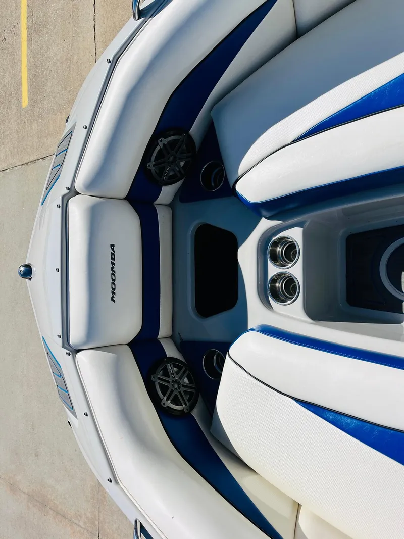 Slide: The Image of 2012 Moomba Mojo 2.5 boat interior with white and blue seating. - 15