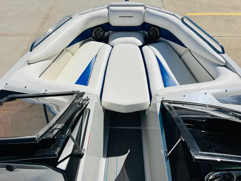 Slide: The Image of 2012 Moomba Mojo 2.5 boat interior with white and blue seating. - 16