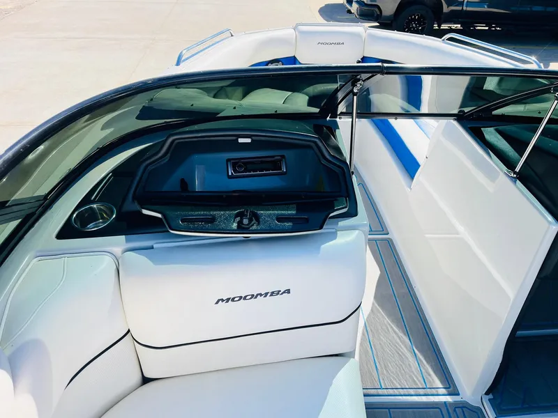 Slide: The Image of 2012 Moomba Mojo 2.5 boat interior with white seating and dashboard. - 18