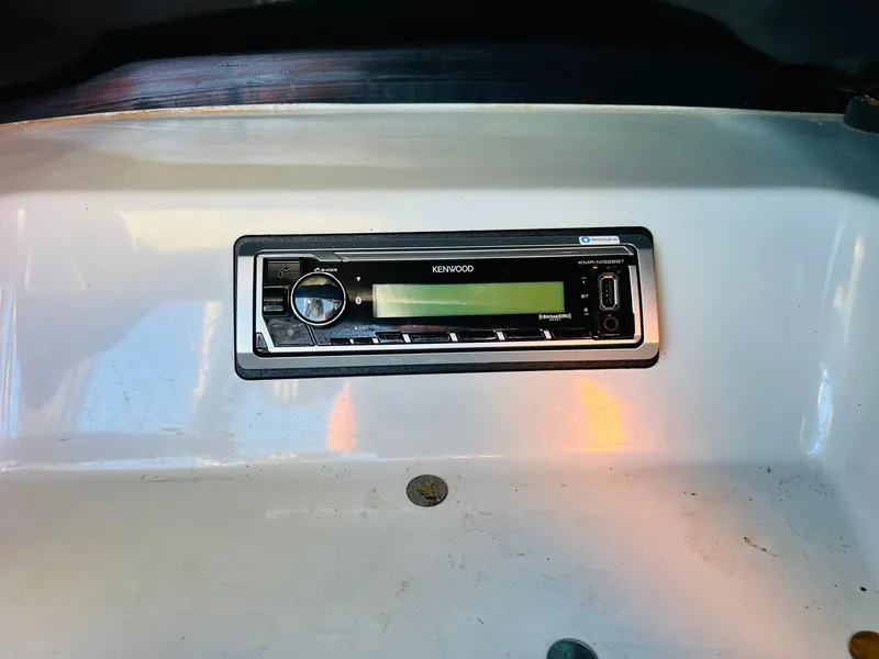 Slide: The Image of 2012 Moomba Mojo 2.5 dashboard with Kenwood stereo system. - 19