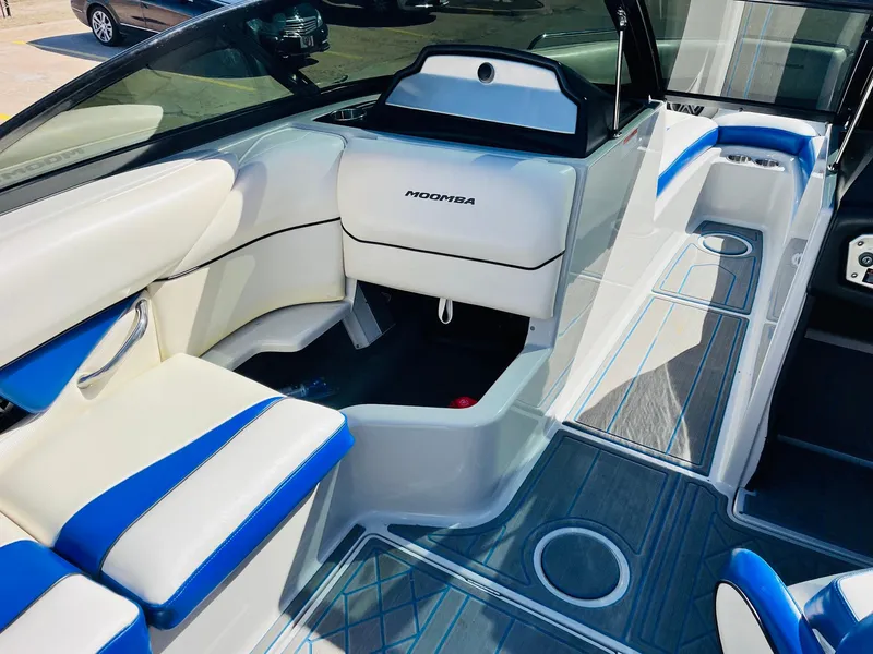 Slide: The Image of 2012 Moomba Mojo 2.5 boat interior with white and blue seating. - 20