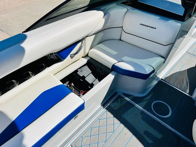 Slide: The Image of 2012 Moomba Mojo 2.5 boat interior with white and blue seating. - 22