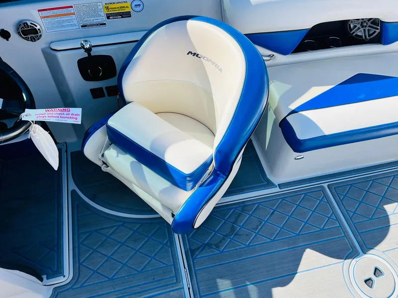 Slide: The Image of 2012 Moomba Mojo 2.5 boat interior with blue and white seating. - 30