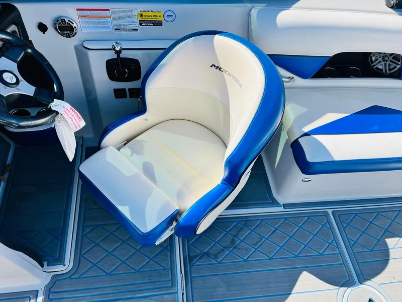Slide: The Image of 2012 Moomba Mojo 2.5 boat interior with blue and white seating. - 31