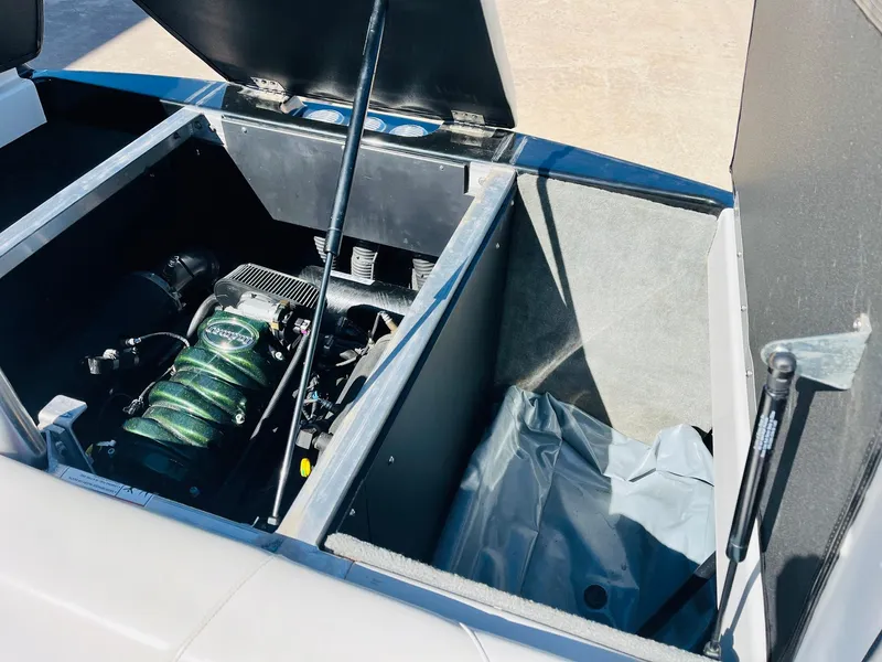 Slide: The Image of 2012 Moomba Mojo 2.5 engine compartment with open hatch, showcasing internal components. - 33