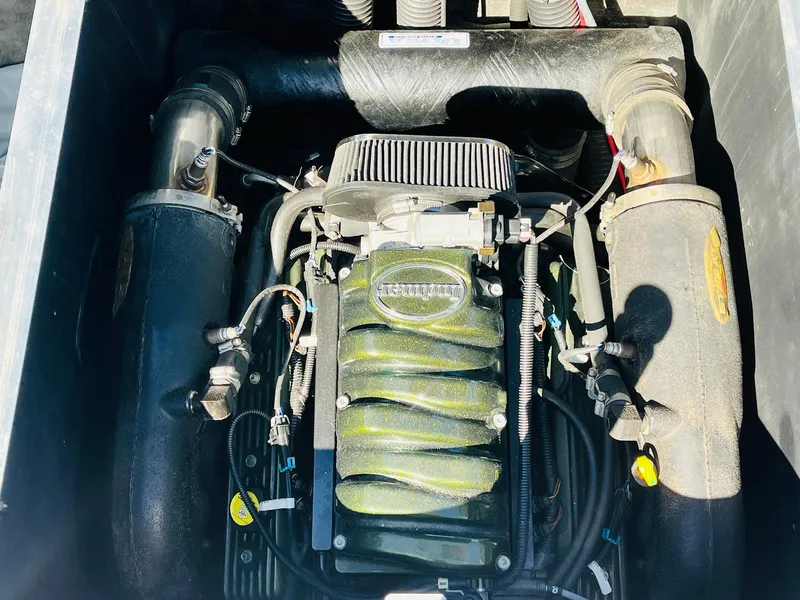 Slide: The Image of 2012 Moomba Mojo 2.5 engine compartment with visible components and wiring. - 34