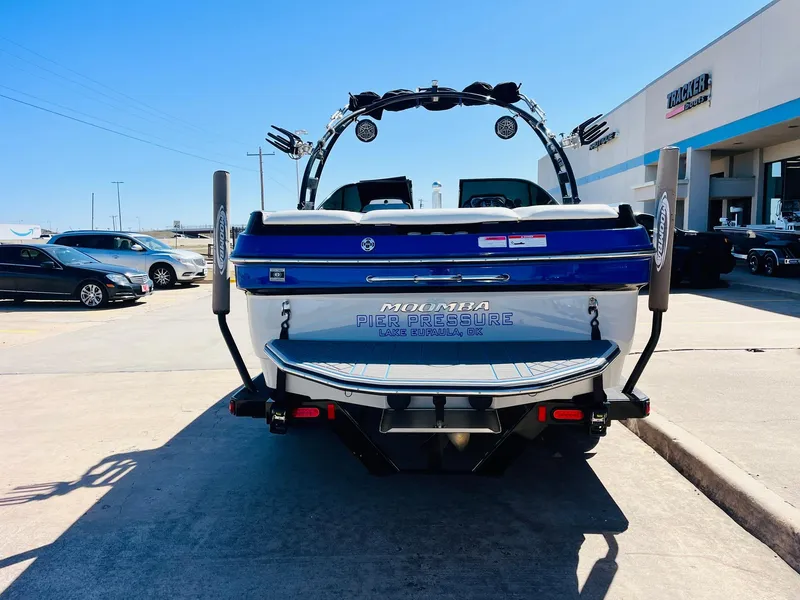 Slide: The Image of 2012 Moomba Mojo 2.5 boat, rear view, parked outdoors on a sunny day. - 5