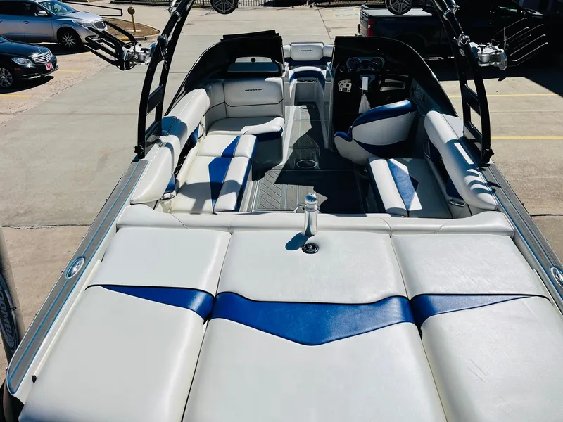 Slide: The Image of 2012 Moomba Mojo 2.5 boat interior with white and blue seating. - 8