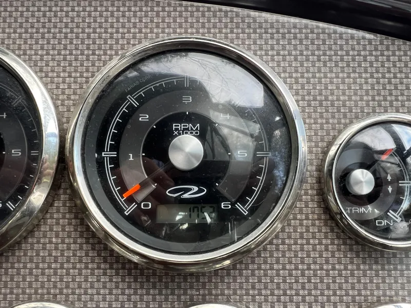 Slide: The Image of Close-up of 2013 Regal 30 Express boat RPM gauge and trim indicator. - 21
