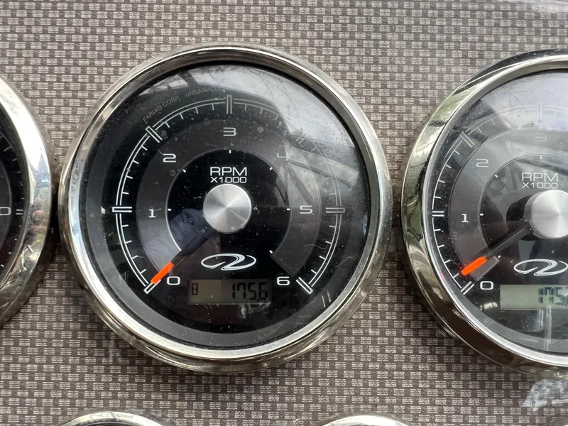 Slide: The Image of Close-up of 2013 Regal 30 Express RPM gauges displaying engine speed. - 22