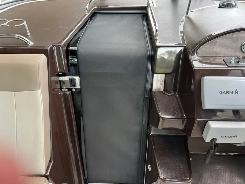 Slide: The Image of 2013 Regal 30 Express boat interior with Garmin navigation system. - 23