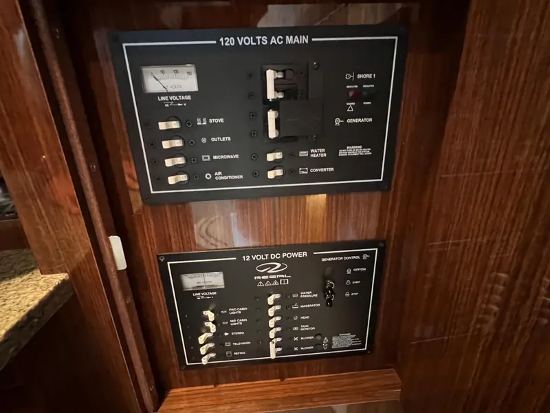 Slide: The Image of Electrical control panels on a 2013 Regal 30 Express boat. - 36