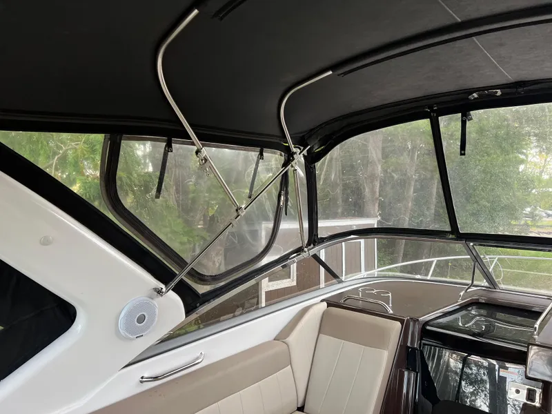 Slide: The Image of Interior view of a 2013 Regal 30 Express boat with seating and windows. - 40