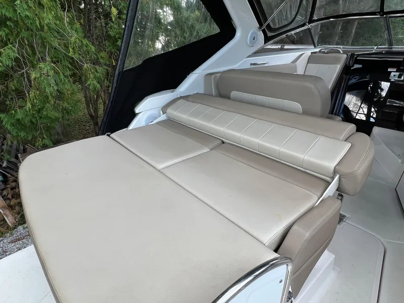Slide: The Image of 2013 Regal 30 Express boat interior with beige seating and modern design. - 8