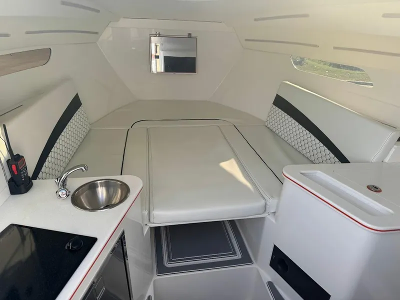 Slide: The Image of Interior of 2015 Deep Impact 399 Cabin, featuring sleek seating, sink, and modern design elements. - 43