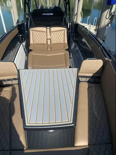 Slide: The Image of 2021 Nor-Tech 390 Sport Center Console with luxurious seating and sleek design. - 10