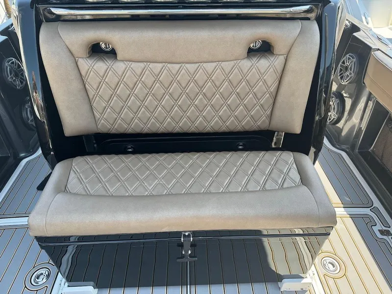 Slide: The Image of 2021 Nor-Tech 390 Sport Center Console, featuring luxurious diamond-stitched seating. - 7