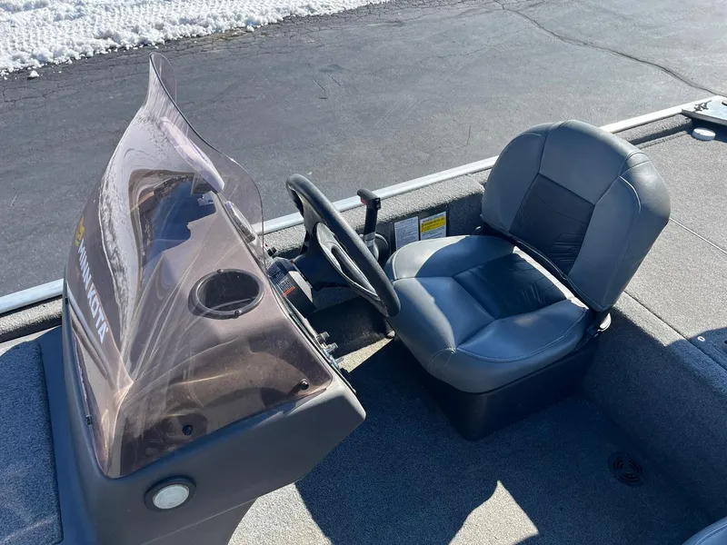 Slide: The Image of 2020 Tracker Bass Tracker Classic XL boat cockpit with steering wheel and seat. - 10
