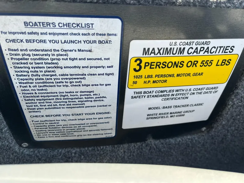 Slide: The Image of 2020 Tracker Bass Tracker Classic XL capacity and safety checklist labels. - 12