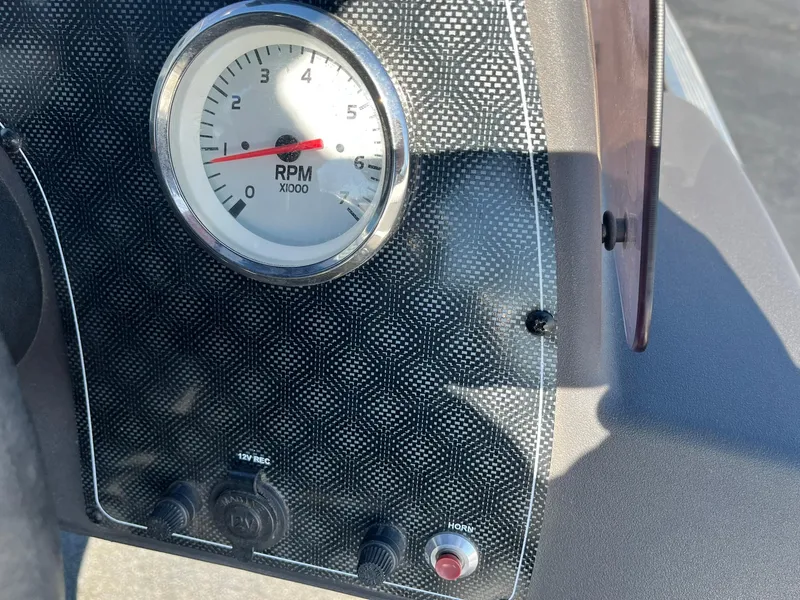 Slide: The Image of Dashboard of 2020 Tracker Bass Tracker Classic XL with RPM gauge and controls. - 14