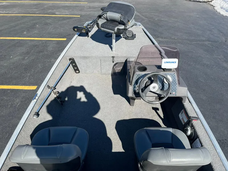 Slide: The Image of 2020 Tracker Bass Tracker Classic XL boat interior with steering wheel and seating. - 16