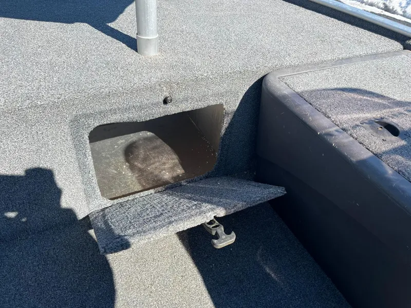Slide: The Image of 2020 Tracker Bass Tracker Classic XL boat storage compartment open. - 17