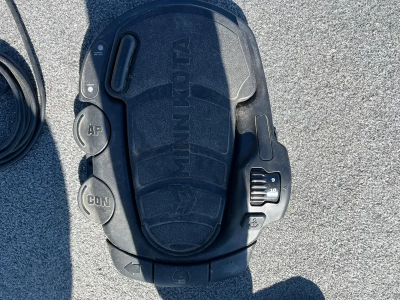 Slide: The Image of Minn Kota foot pedal on 2020 Tracker Bass Tracker Classic XL boat deck. - 19