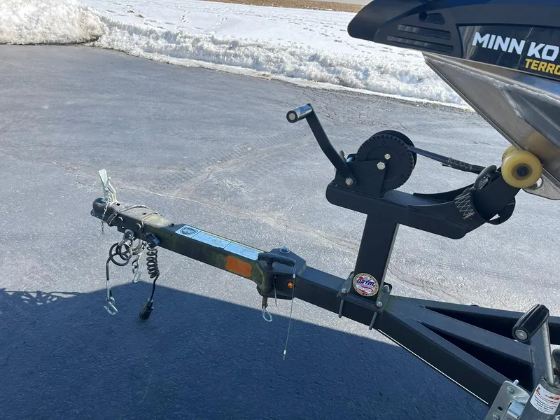 Slide: The Image of 2020 Tracker Bass Tracker Classic XL trailer hitch with Minn Kota motor on asphalt. - 24