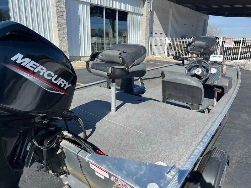 Slide: The Image of 2020 Tracker Bass Tracker Classic XL boat with Mercury engine, parked outdoors. - 8
