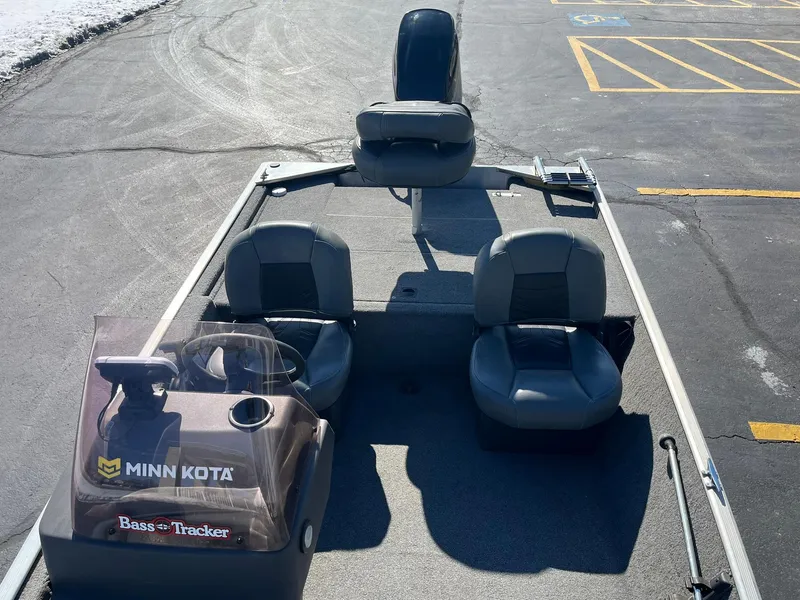 Slide: The Image of 2020 Tracker Bass Tracker Classic XL boat with Minn Kota motor in parking lot. - 9
