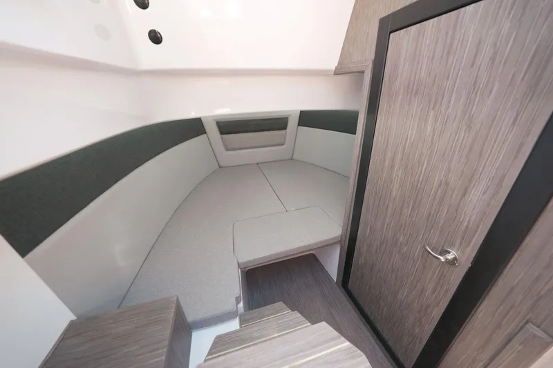 Slide: The Image of Interior cabin of 2025 Ranieri NEXT 255 LX boat, featuring modern design and wood finishes. - 21