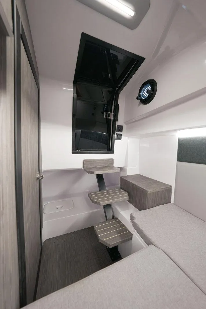 Slide: The Image of Interior of 2025 Ranieri NEXT 255 LX boat, featuring modern design and compact layout. - 23