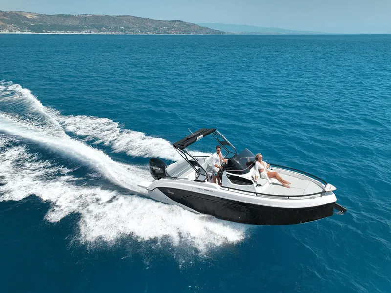 Slide: The Image of 2025 Ranieri NEXT 255 LX cruising on clear blue ocean waters. - 3