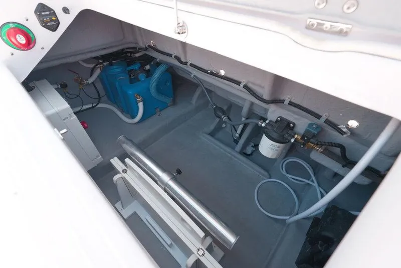 Slide: The Image of Engine compartment of 2025 Ranieri NEXT 255 LX boat, showcasing mechanical components and wiring. - 30