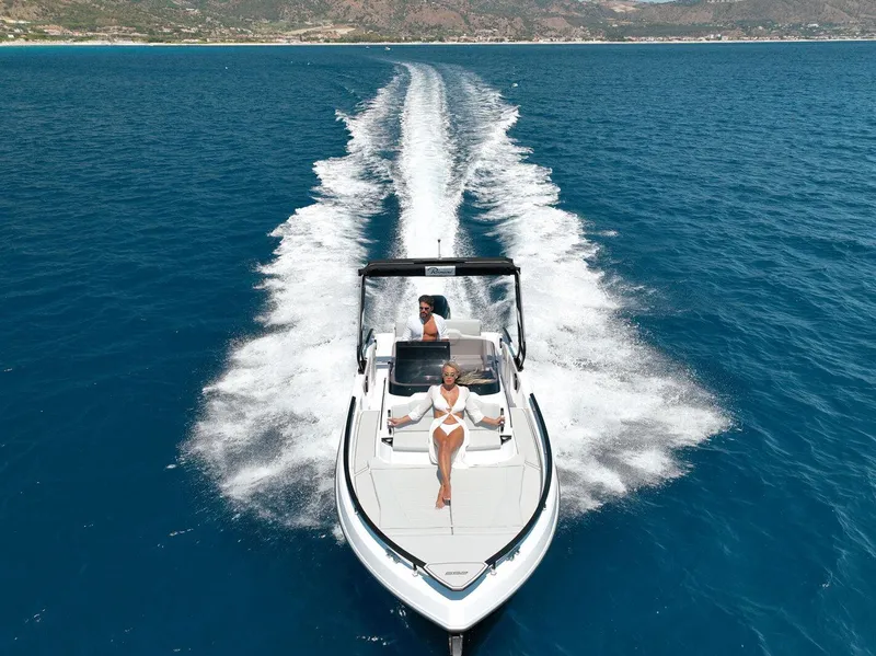 Slide: The Image of 2025 Ranieri NEXT 255 LX cruising on open blue sea, showcasing luxury and speed. - 4