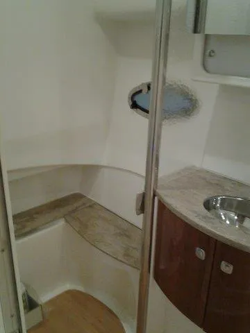 Slide: The Image of 2017 Formula 40 Performance Cruiser bathroom interior with sink and seating area. - 11