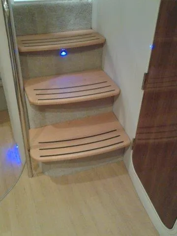 Slide: The Image of Wooden steps with blue LED lights on a 2017 Formula 40 Performance Cruiser. - 14