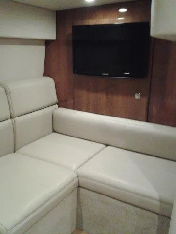 Slide: The Image of 2017 Formula 40 Performance Cruiser interior with beige seating and wall-mounted TV. - 17