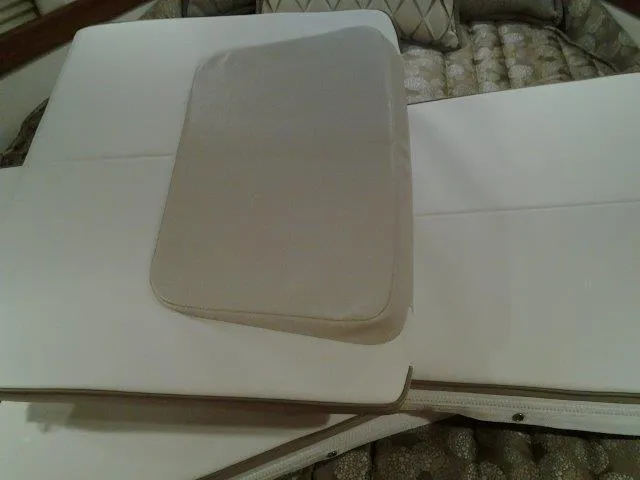 Slide: The Image of Cushioned seating area on a 2017 Formula 40 Performance Cruiser boat interior. - 18