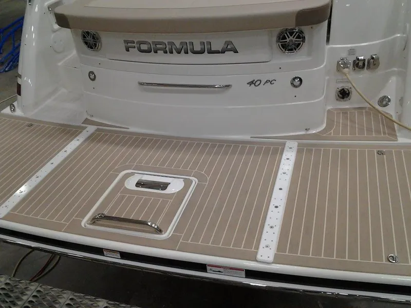 Slide: The Image of 2017 Formula 40 Performance Cruiser, rear deck view with branded logo and teak flooring. - 25
