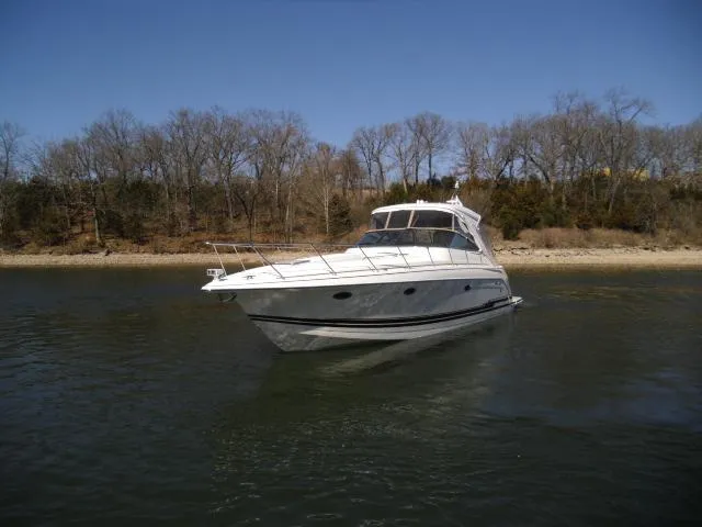Slide: The Image of 2017 Formula 40 Performance Cruiser on calm water, with trees in the background. - 42