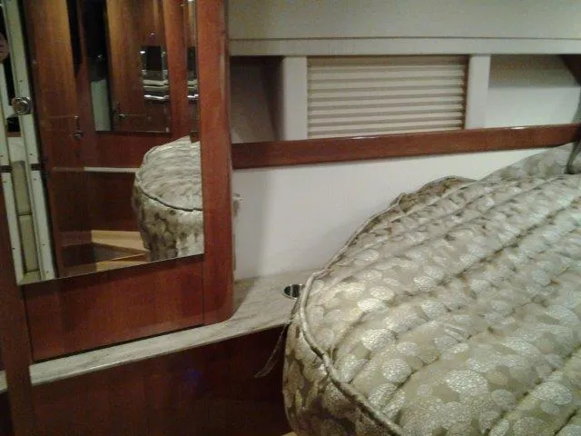 Slide: The Image of Interior of 2017 Formula 40 Performance Cruiser with elegant bedding and wood accents. - 5