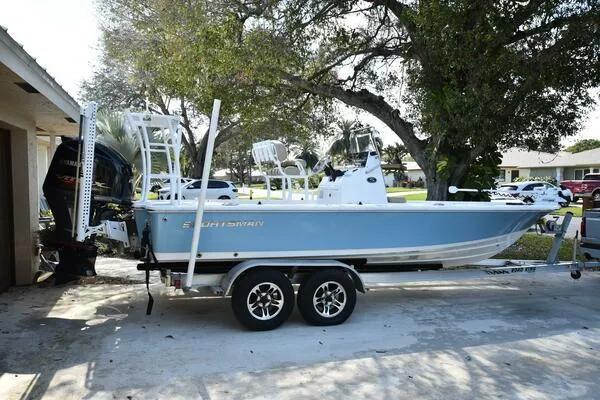 Slide: The Image of 2018 Sportsman Tournament 214 Bay Boat on trailer, parked outdoors. - 1