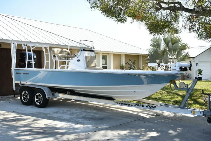 Slide: The Image of 2018 Sportsman Tournament 214 Bay Boat on trailer in driveway. - 2