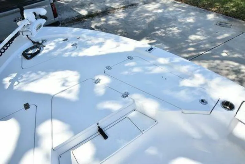 Slide: The Image of 2018 Sportsman Tournament 214 Bay Boat deck with storage compartments and trolling motor. - 21